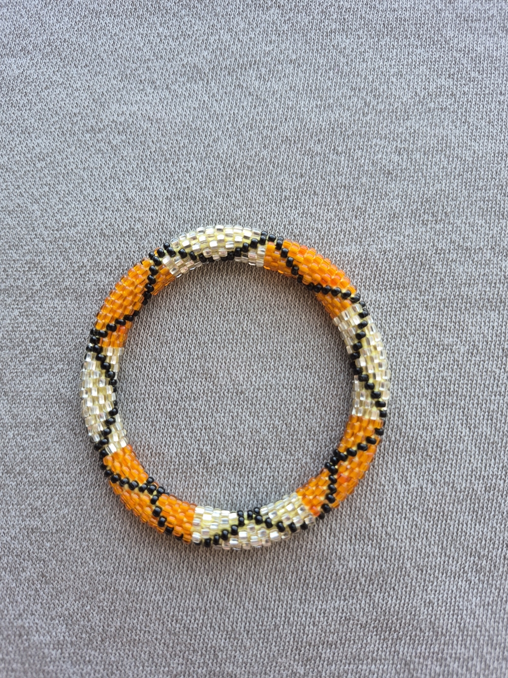 Handwoven Orange and Cream Beaded Spiral Bracelet